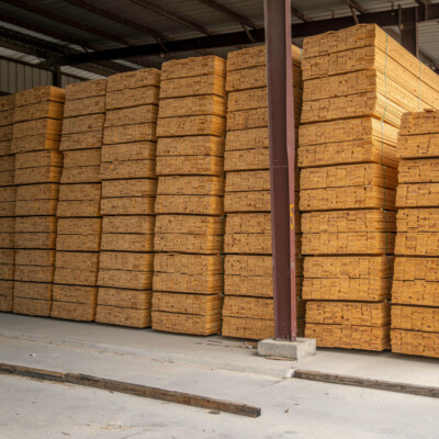 Photo by Mark Stebnicki: https://www.pexels.com/photo/pile-of-wood-planks-inside-a-warehouse-12278570/